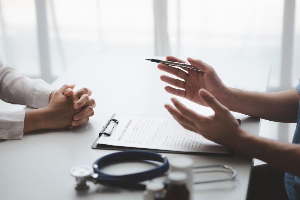 healthcare provider hands and patient hands, explaining primary care