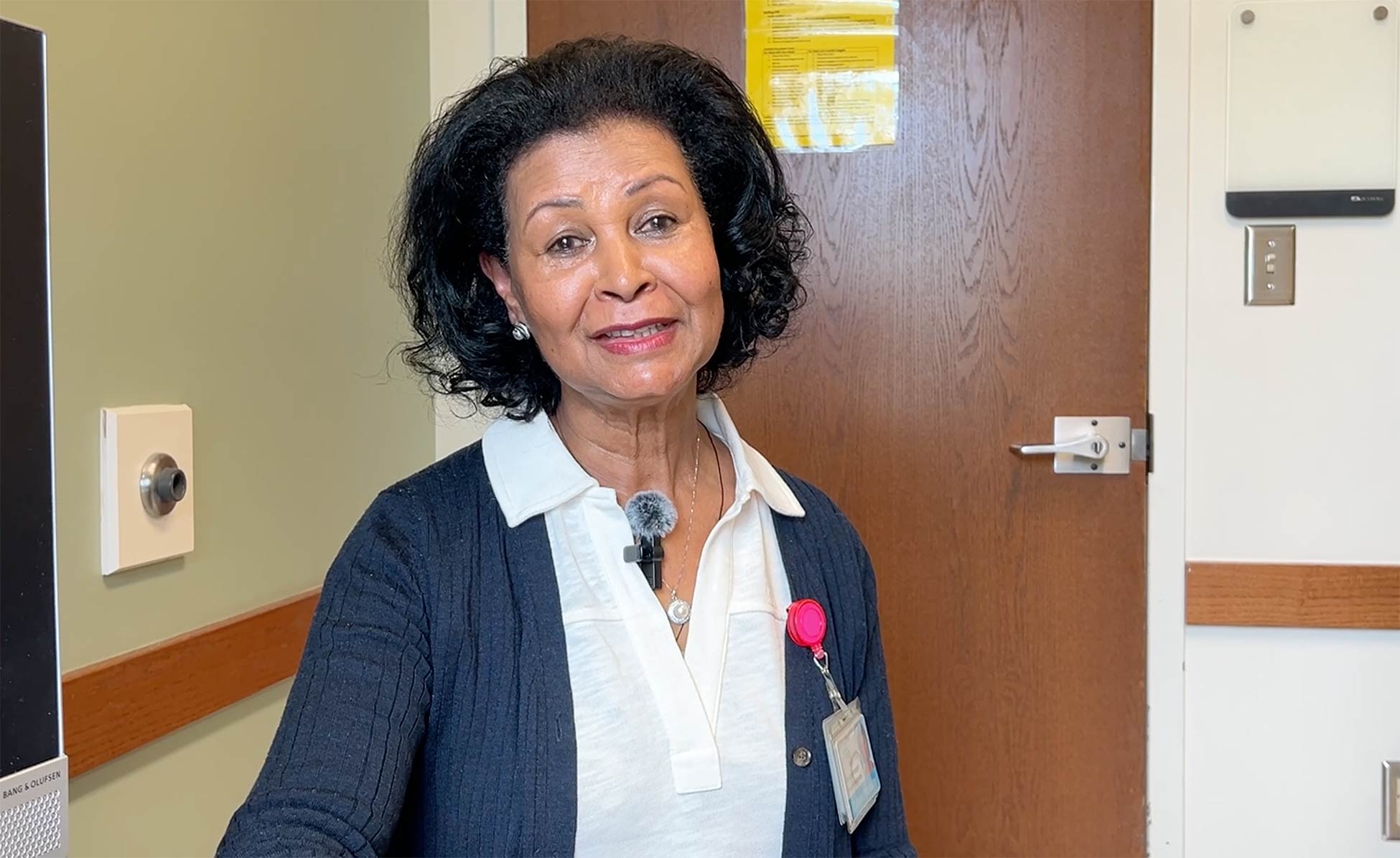 Amharic speaking woman, smiling at camera